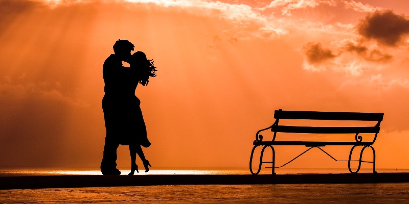 Couple embracing at sunset